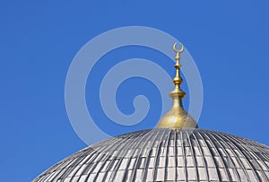 Mosque Dome with a Golden Crescent Moon