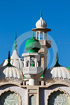 Mosque green domes and minaret towers