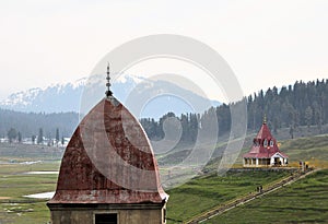 Mosque and Hindu temple in mountains of Kashmir photo