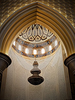 Mosque interior brown and gold ambience with chandelier and beautiful ornamen photo