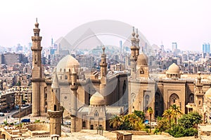 The Mosque-Madrassa of Sultan Hassan and the Pyramids in the background, Cairo, Egypt