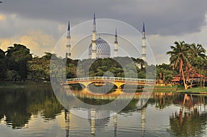 Mosque minaret and dome with reflection