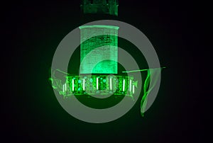 mosque minaret green light at night