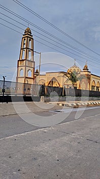 a mosque next to the main road which is always full of worshipers