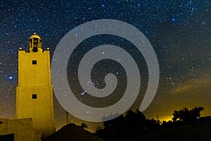 Mosque at night in island of Djerba with milkiway and asters photo