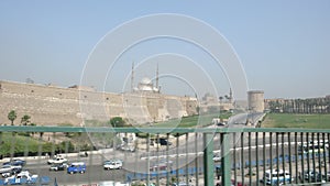 A mosque shines like metal from afar