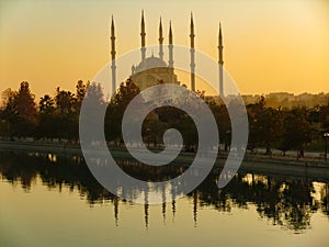 Mosque at sunset, Lake and reflection. Adana Merkez Mosque Camii, Turkey