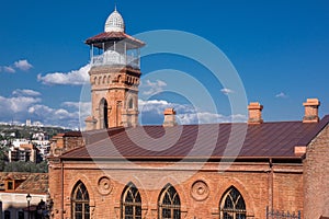 Mosque in tblisi red brick building and blue sky