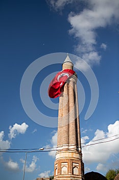 Mosque with turkish flag in blue sky