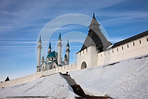 Mosque with turquoise spires, depending with white wall