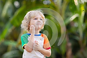 Mosquito on kids skin. Insect bite repellent