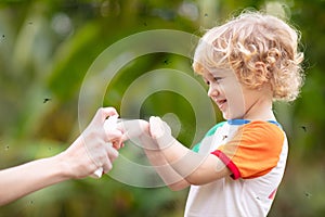 Mosquito on kids skin. Insect bite repellent