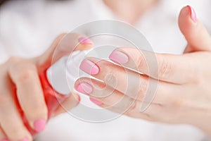 Mosquito repellent. Woman using insect repellent spray