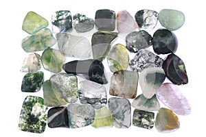 Moss agate heap stones texture on white light background