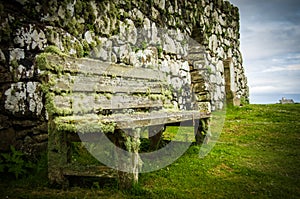 Moss coverd bench at Trumpan Church on Isle of Skye in Scotland