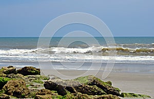 Moss Coverd Rocks On Beach Ocean Waves