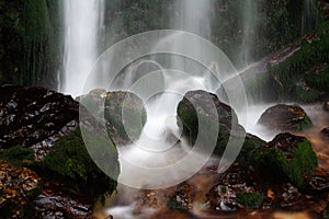 Moss on rocks and waterfall