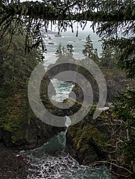 Mossy Rocks And Rough Surf Along Oregon Coast