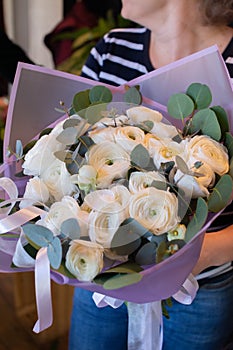 Flowers on a leg in the interior of the restaurant for a celebration shop floristry or wedding photo