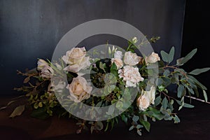 Bouquet of flowers on a leg in the interior of the restaurant for a celebration shop floristry or wedding salon