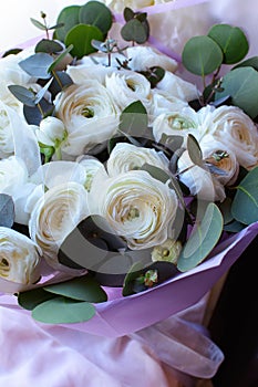 Bouquet of flowers on a leg in the interior of the restaurant for a celebration shop floristry or wedding salon