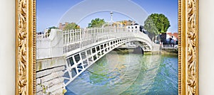 The most famous bridge in Dublin called `Half penny bridge` concept image with a golden wooden frame