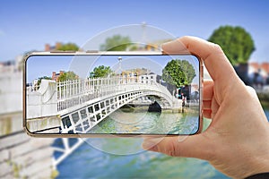 The most famous bridge in Dublin called Half penny bridge due to the toll charged for the passage - Smartphone concept