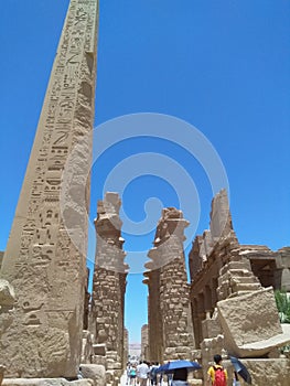 The most famous obelisk in the Karnak, temple complex, Luxor, Egypt, ancient ruins, stones,visiting tourists