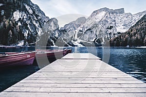 Most famous and touristic  italian mountain lake. Lago di Braies, Italy. vintage toned picture with  filter photo