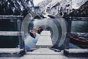 Most famous and touristic  italian mountain lake. Lago di Braies, Italy. vintage toned picture photo