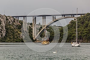 Most Krka bridge and sailboats near Skradin town, Croat