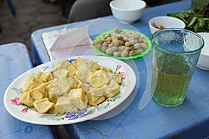 Most seen and simple dishes for drinking street beer in Hanoi: fried tofu, boiled peanut and beer