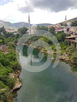 Mostar mosque and green Neretva river