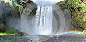 Skogafoss Waterfall with Double Rainbow Landscape Panorama, Katla Geopark, South Coast of Iceland photo