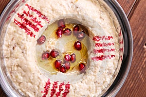 Motabal or mutabal and baba ghanoush with pomegranate seeds served in dish isolated on background top of arabic food cold mezza