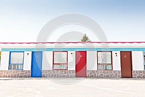 Motel with red and blue doors