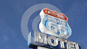 Motel retro sign on historic route 66 famous travel destination, vintage symbol of road trip in USA. Iconic lodging signboard in