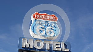 Motel retro sign on historic route 66 famous travel destination, vintage symbol of road trip in USA. Iconic lodging signboard in