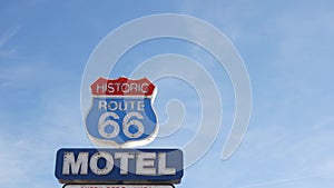 Motel retro sign on historic route 66 famous travel destination, vintage symbol of road trip in USA. Iconic lodging signboard in