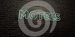 MOTELS -Realistic Neon Sign on Brick Wall background - 3D rendered royalty free stock image photo