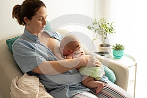 Mothed and baby, breastfeeding in laid back position