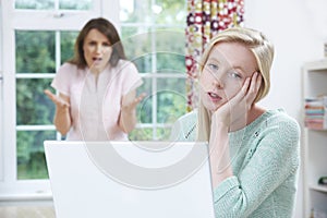 Mother Arguing With Teenage Daughter Over Online Activity