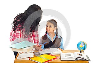 Mother asking girl about homework photo