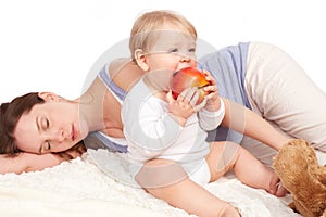 Mother is asleep and child eats