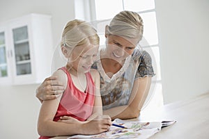 Mother Assisting Daughter In Homework