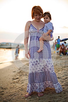 Mother and baby on beach