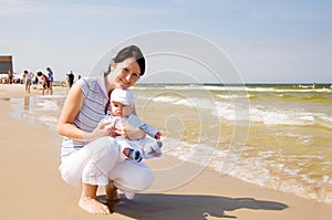 Mother with baby at the beach