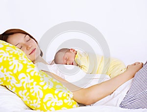 Mother and baby boy sleeping together