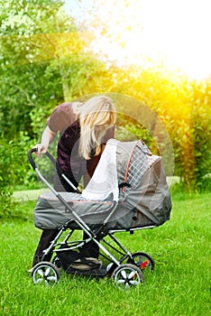 Mother with baby carriage