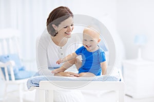 Mother and baby on changing table